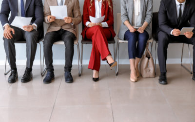 potential new hires wait to be interviewed by hr agent