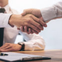 peo broker shaking hands with business owner